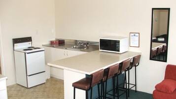 Fridge, microwave, cookware/dishes/utensils