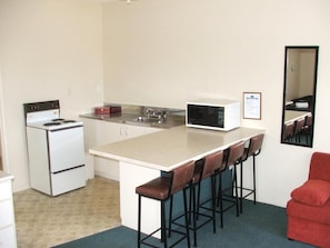 Fridge, microwave, cookware/dishes/utensils
