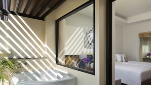 A modern bathroom with a large mirror, a round sink, and a potted plant. - Avani Ao Nang Cliff Krabi Resort (Krabi)