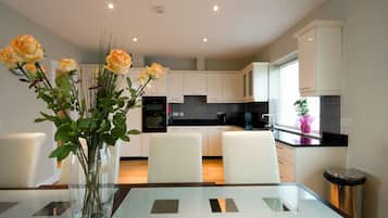 Penthouse, 2 Bedrooms | Private kitchen | Full-sized fridge, microwave, oven, stovetop