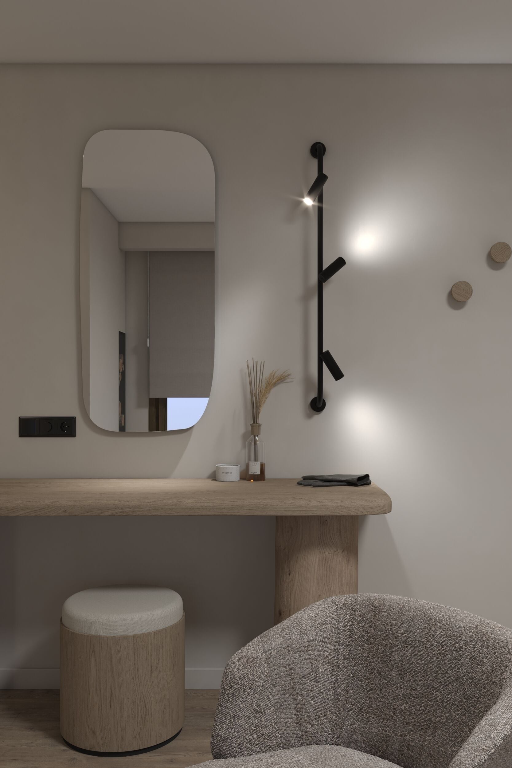 A minimalist room with a wooden bench, a round ottoman, a chair, a wall-mounted mirror, and a black light fixture.