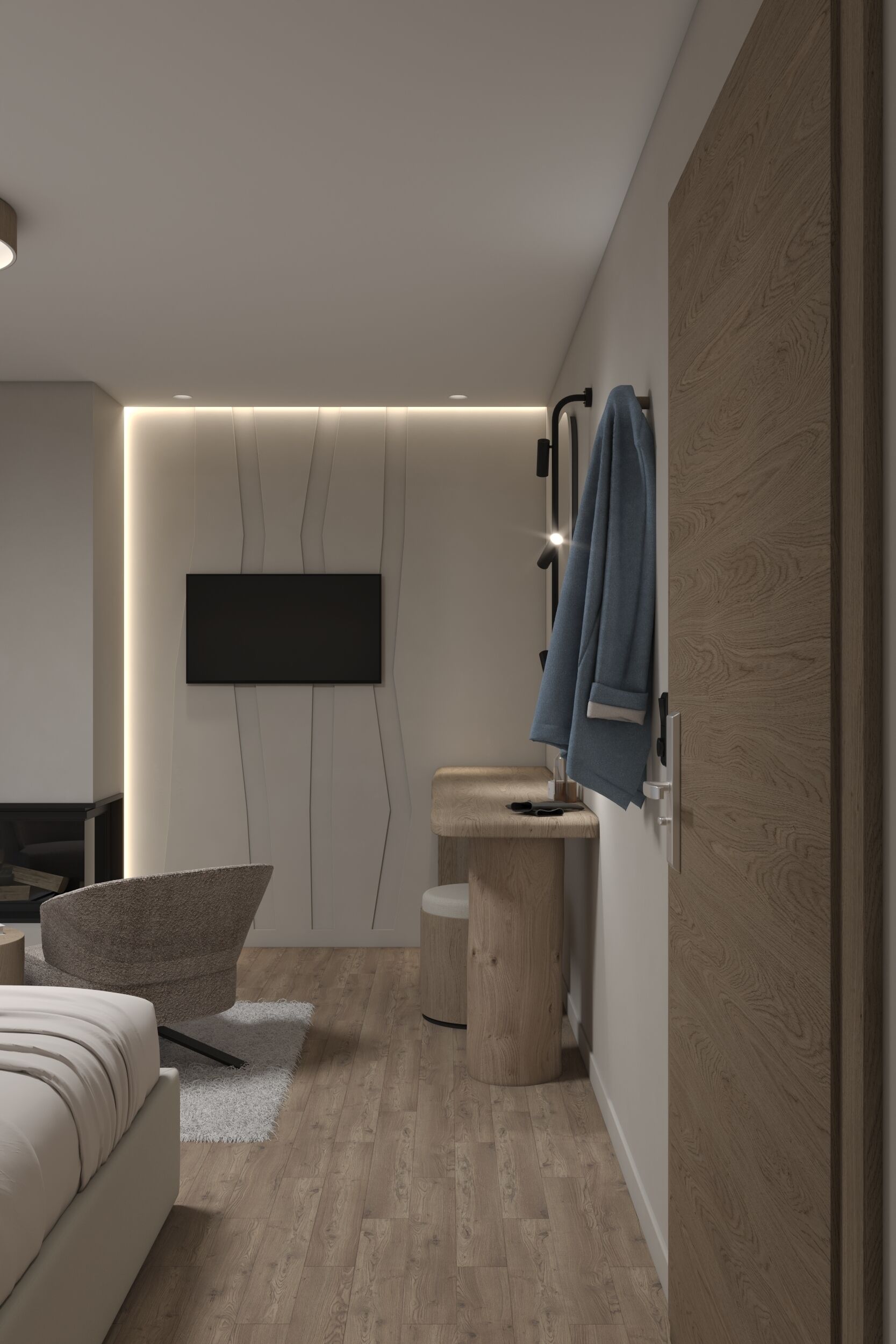 A modern bedroom with a bed, a TV mounted on the wall, a wooden wardrobe, and a small round table.