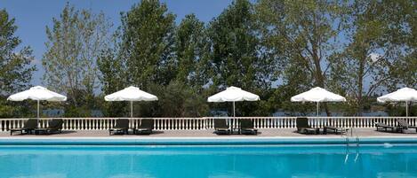 Seasonal outdoor pool, pool umbrellas, pool loungers