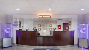 A reception area with a 'Rest & Refresh' sign, a 'Welcome to Orange' mat, and a 'No Smoking' sign. - Comfort Inn Orange I-10 (Orange)