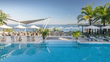 2 outdoor pools, open 10 AM to 8 PM, pool umbrellas, pool loungers