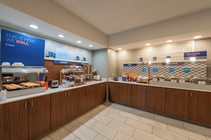 A breakfast buffet area with labeled sections for bakery, cereal, fruit, hot food, and egg-xactly. - Holiday Inn Express Hotel & Suites LAMAR by IHG (Lamar)