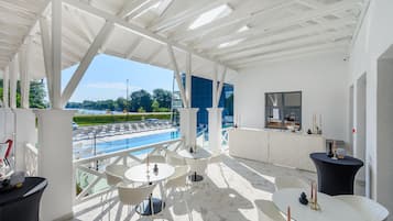 Indoor pool, seasonal outdoor pool, pool umbrellas, sun loungers