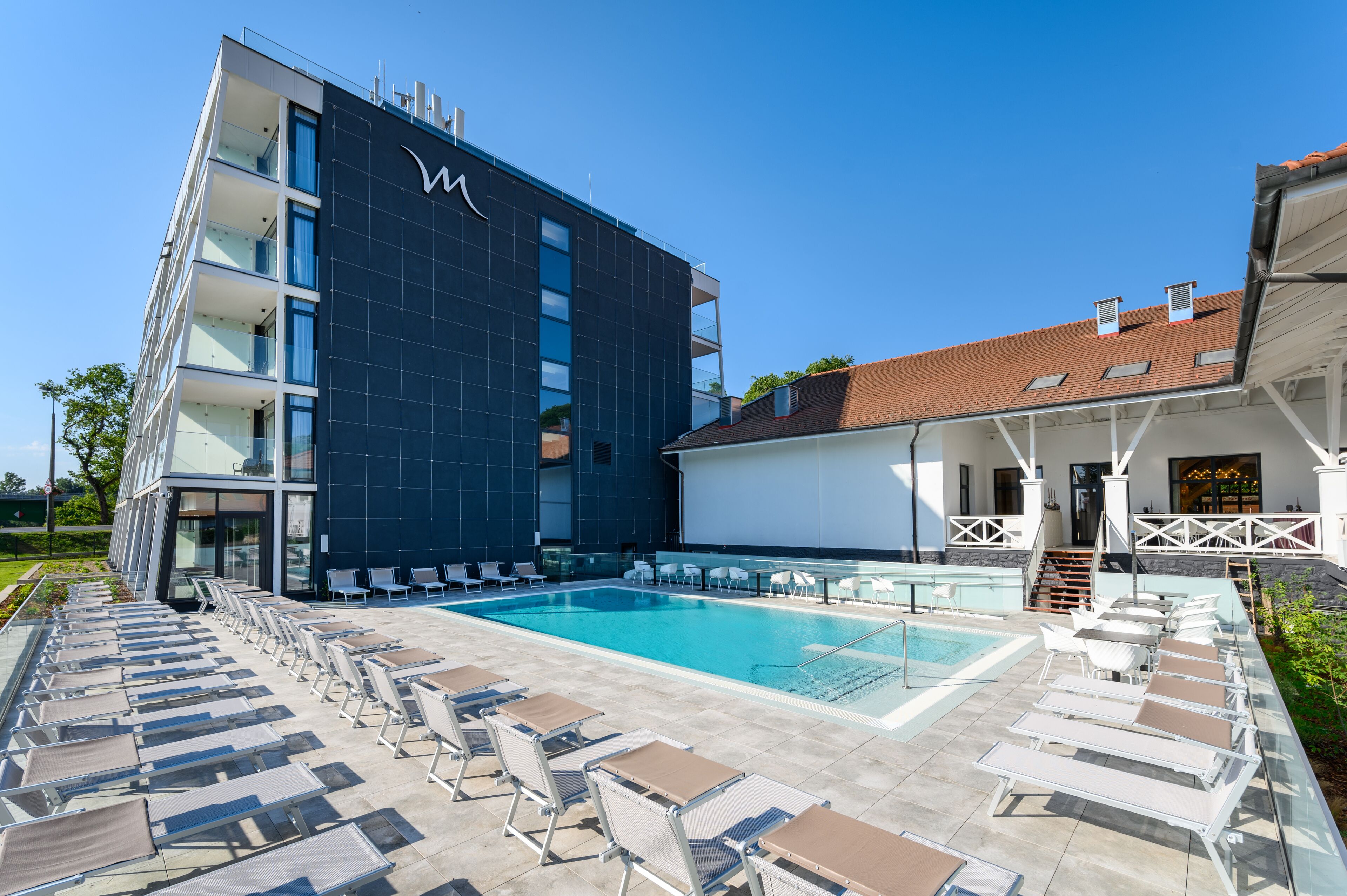 Indoor pool, seasonal outdoor pool, pool umbrellas, pool loungers