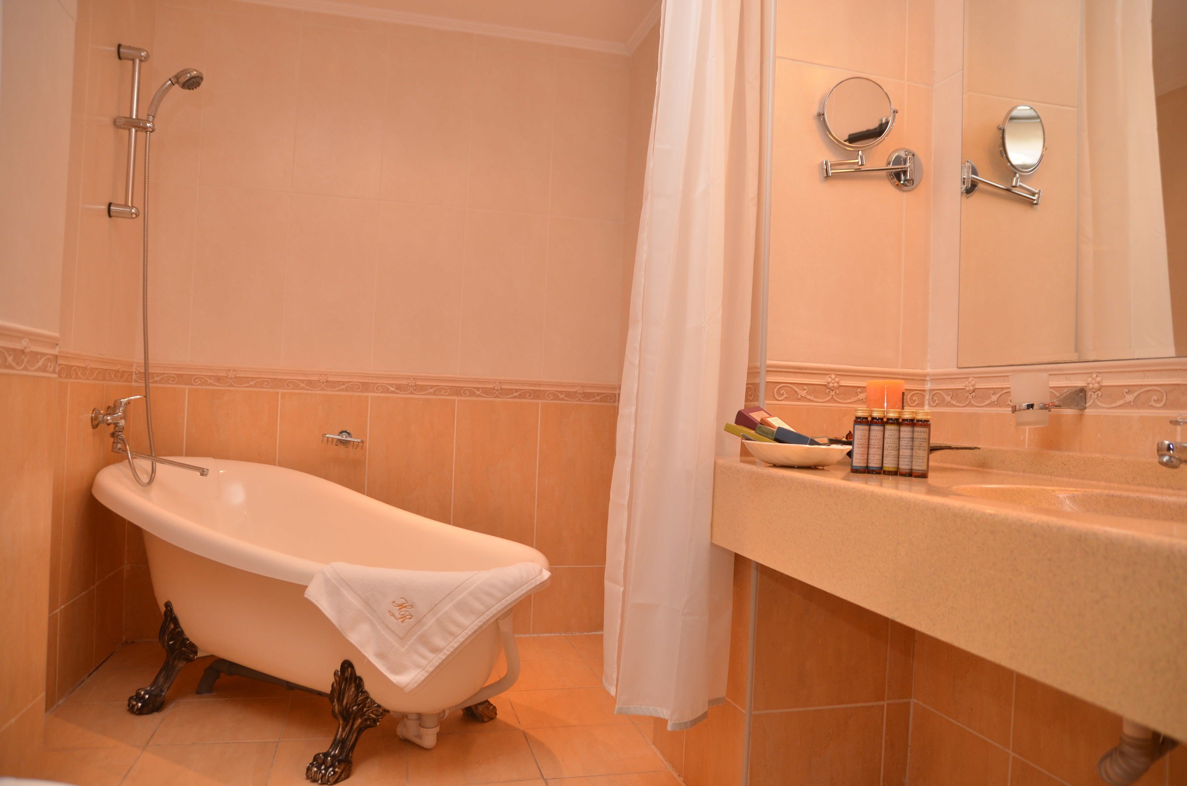 suite | bathroom | hair dryer, bathrobes, slippers, towels