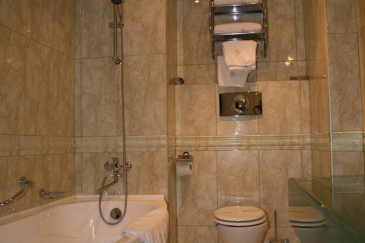 standard apartment | bathroom | hair dryer, bathrobes, slippers, towels