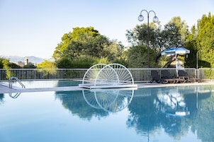 Seasonal outdoor pool, pool umbrellas, pool loungers