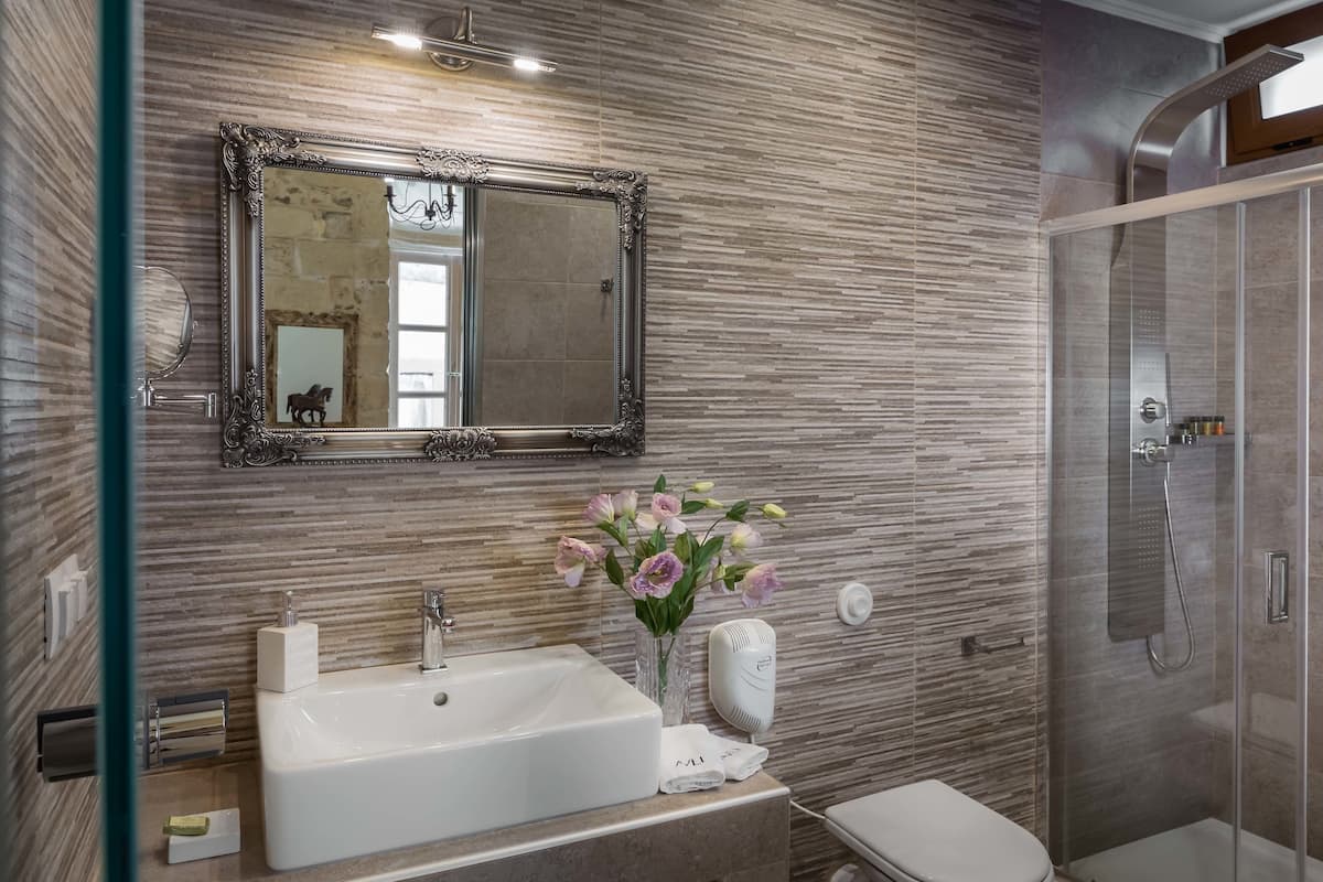 superior room | bathroom | designer toiletries, hair dryer, towels
