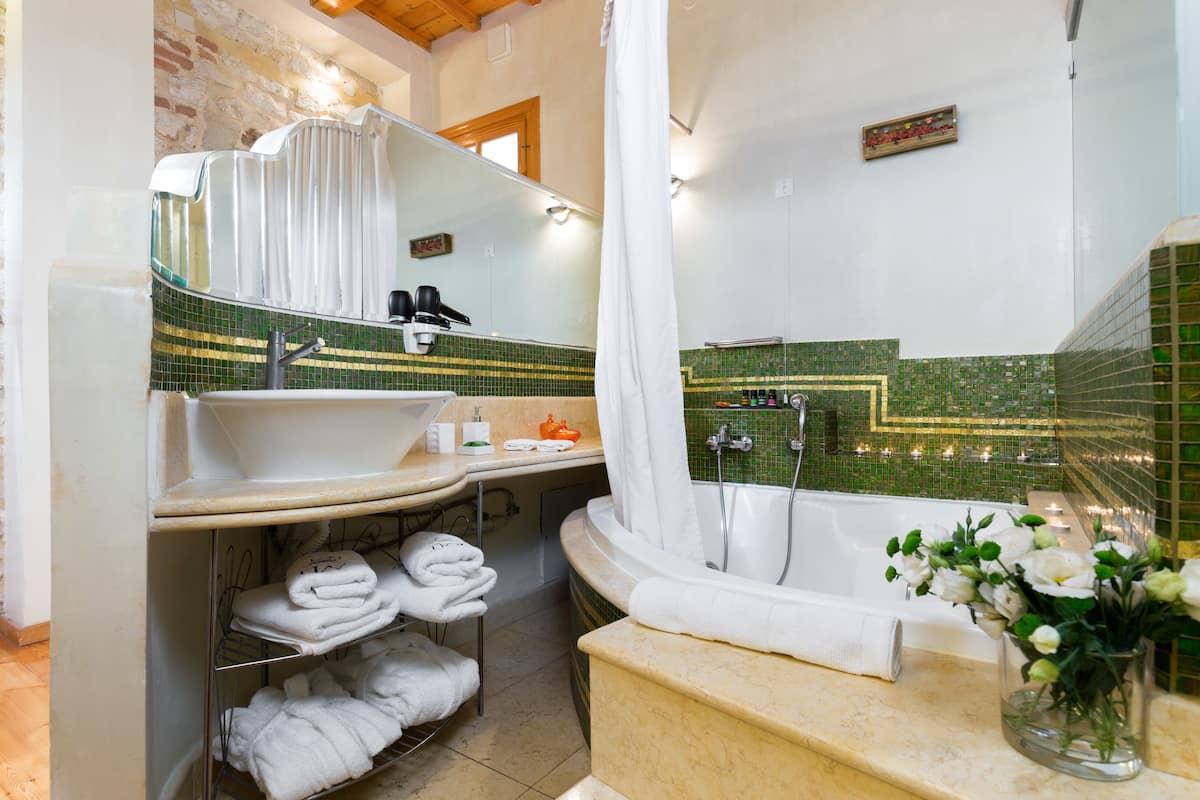 junior suite | bathroom | designer toiletries, hair dryer, towels