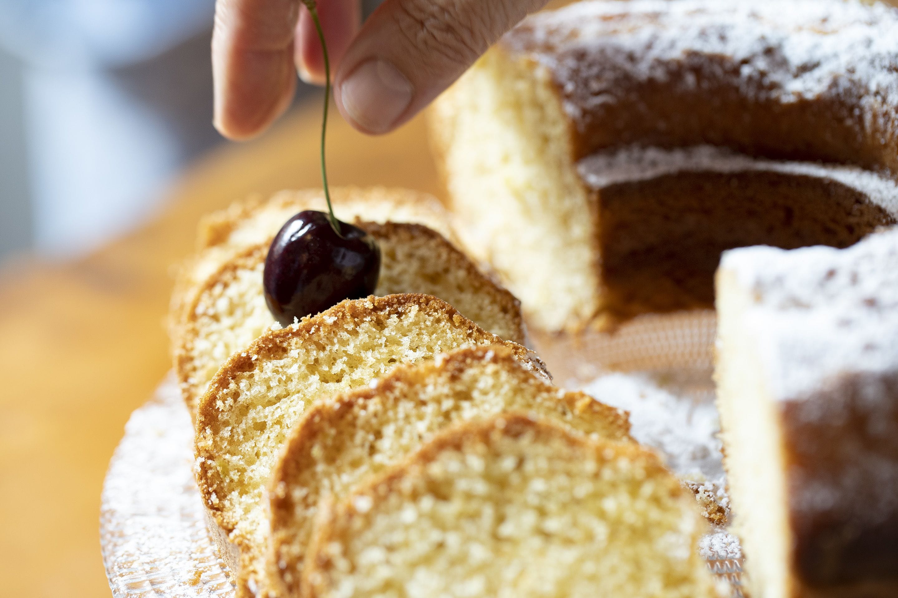 A slice of cake with a cherry on top.