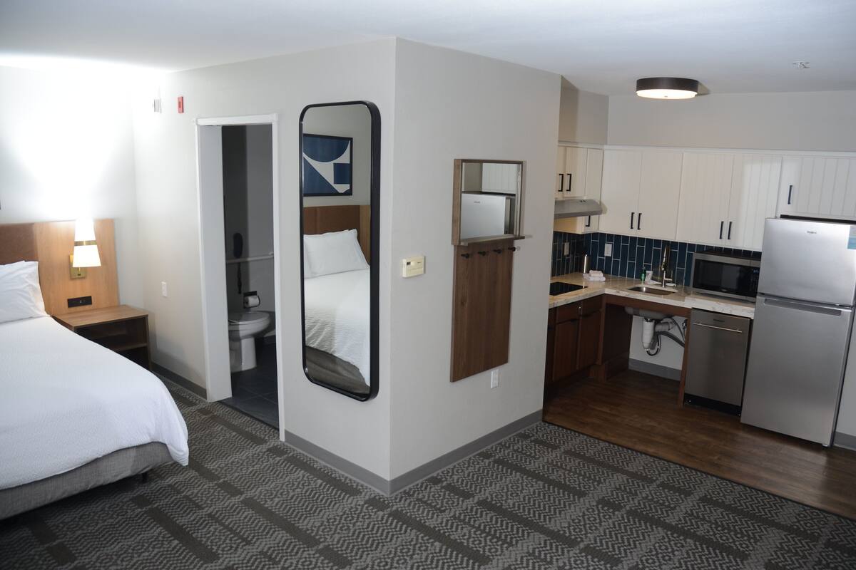 Studio Suite, 1 Queen Bed, Kitchen | In-room safe, desk, laptop workspace, iron/ironing board
