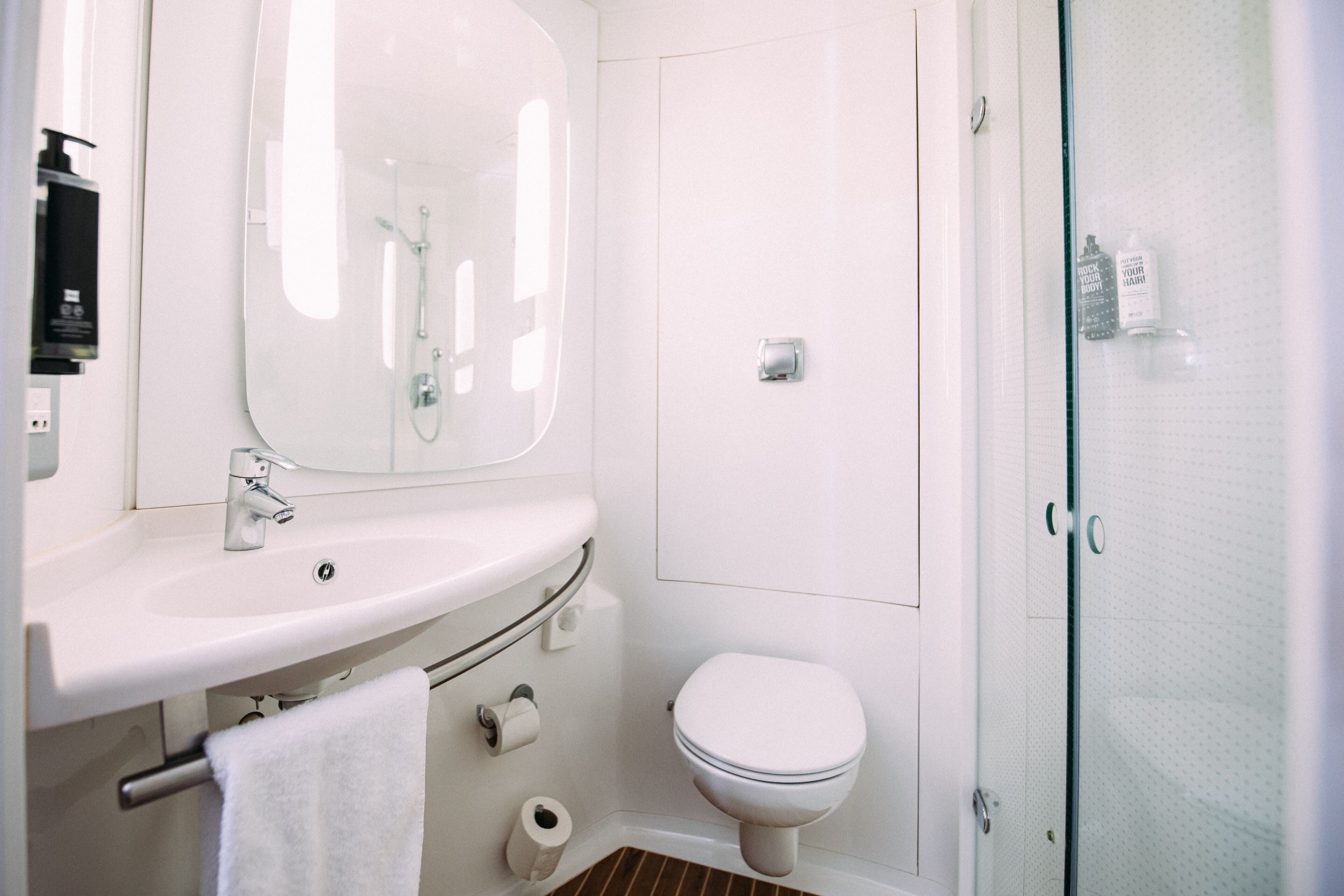 shower, eco-friendly toiletries, hair dryer, towels