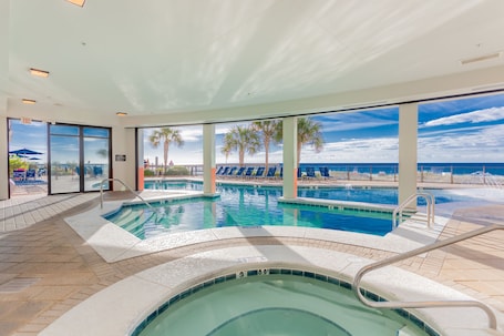 Indoor pool, outdoor pool, pool umbrellas, sun loungers. Hampton Inn & Suites Orange Beach/Gulf Front