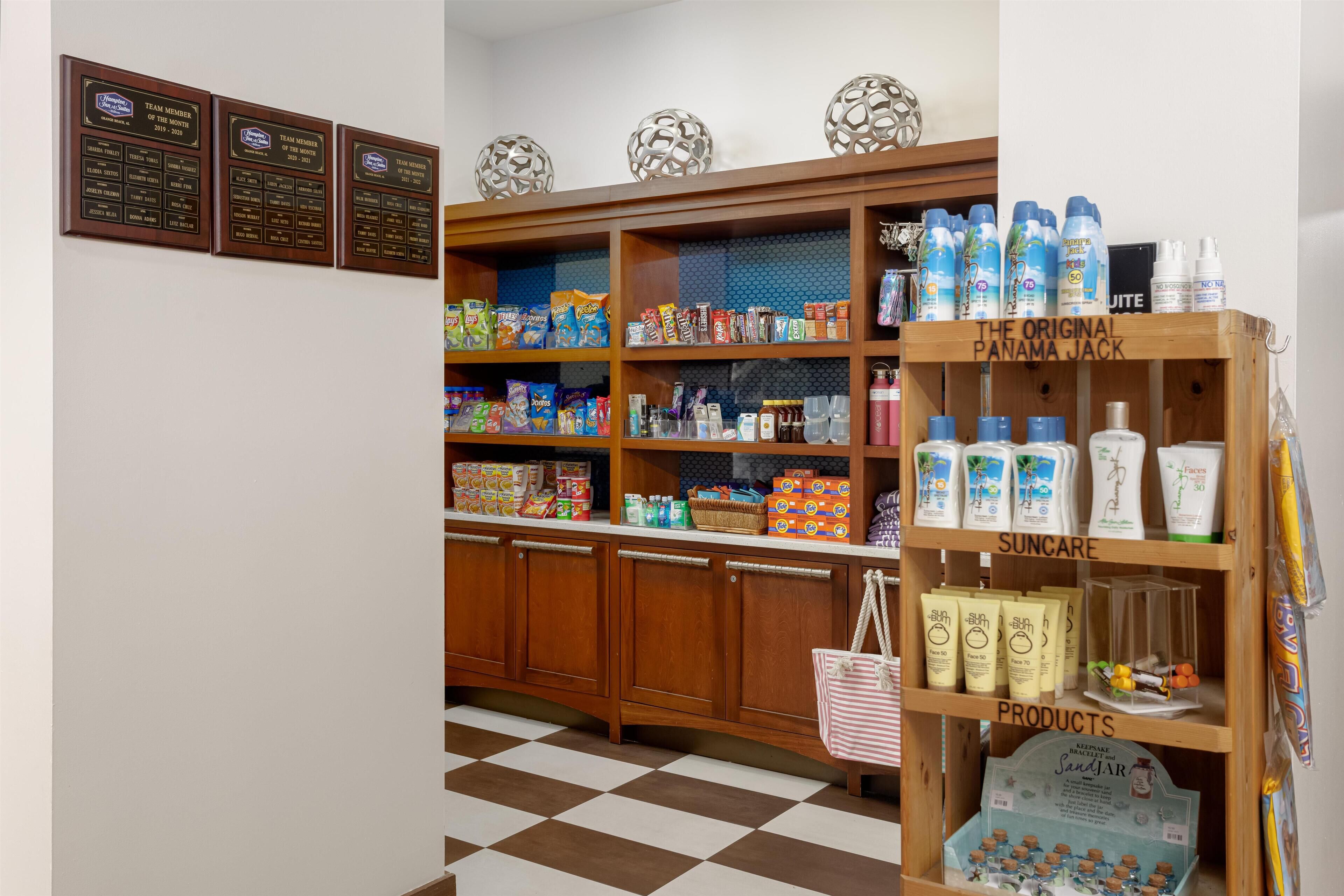 A store with shelves stocked with various products, including toiletries and snacks.