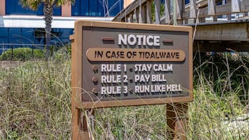 A sign with rules for a tidal wave scenario.