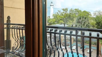 Deluxe Room with 2 beds and a balcony offering a view over the pool | View from room