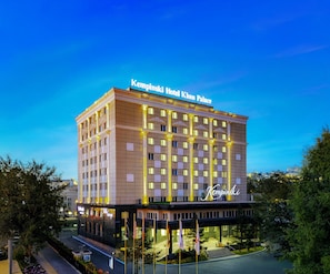 A multi-story hotel with a prominent sign reading 'Kempinski Hotel Khan Palace.' - Kempinski Hotel Khan Palace (Ulaanbaatar)