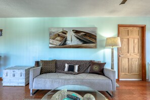 Waterfront Upstairs Suite | Living room | 35-inch Smart TV with cable channels, TV - Sand Vista Vacation Rentals (Redington Shores)