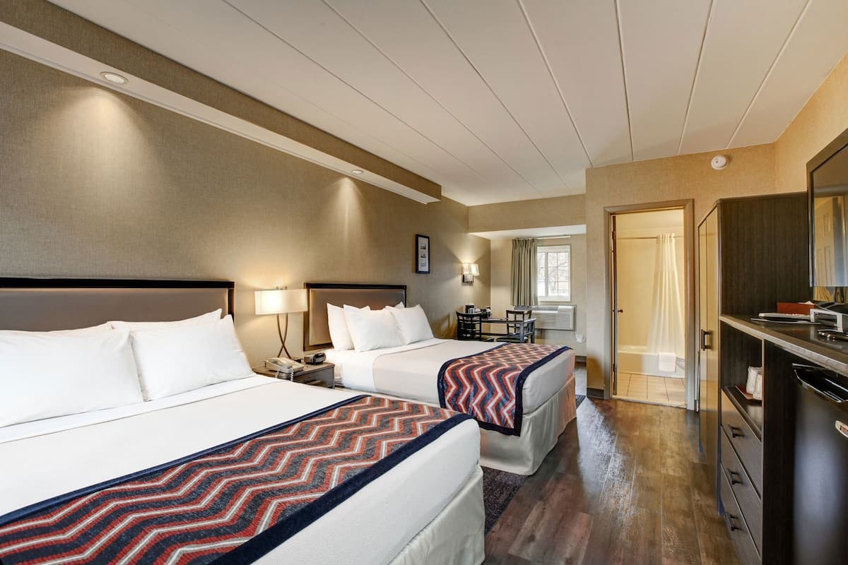Premium bedding, desk, laptop workspace, soundproofing