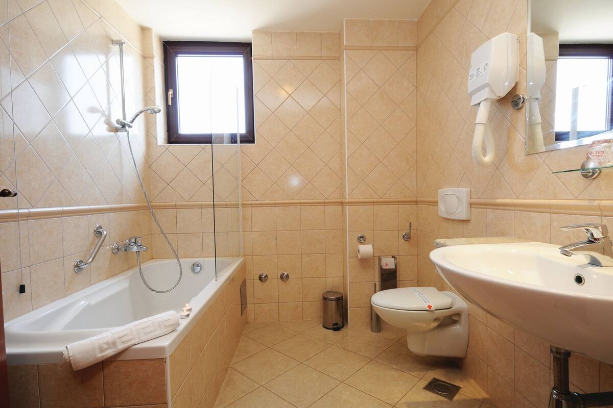 free toiletries, hair dryer, slippers, bidet