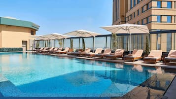 Outdoor pool, pool umbrellas, pool loungers