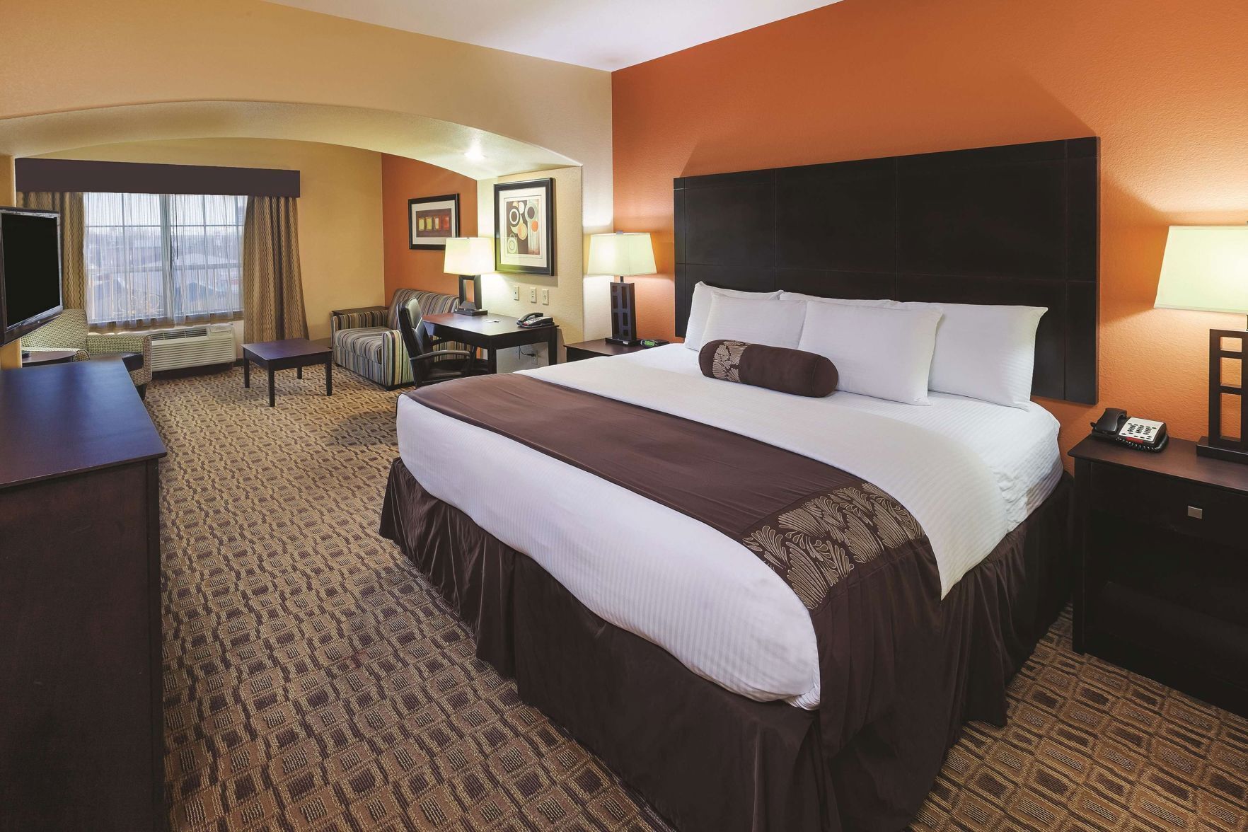 Premium bedding, desk, laptop workspace, soundproofing