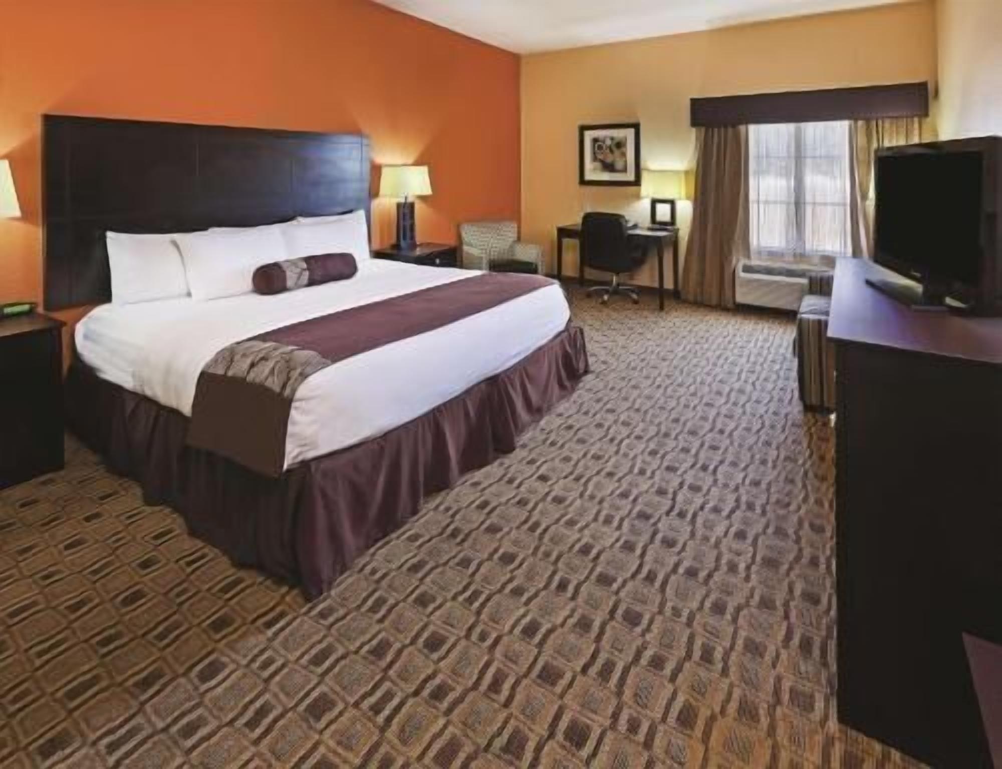 Premium bedding, desk, laptop workspace, soundproofing