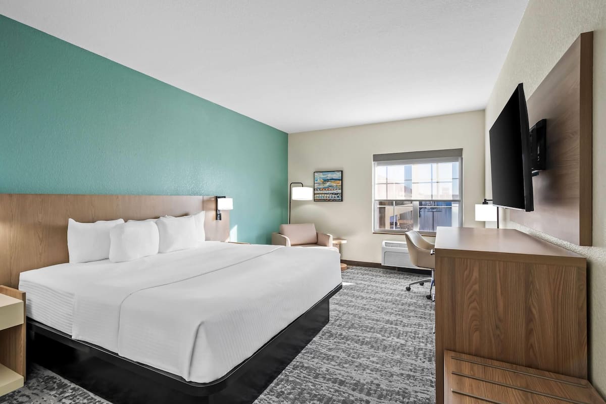 Premium bedding, desk, laptop workspace, soundproofing