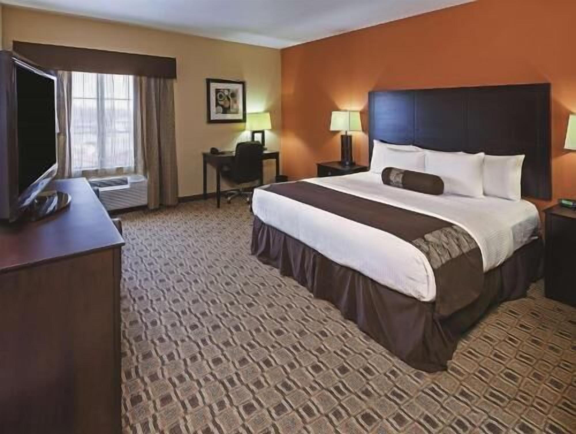 Premium bedding, desk, laptop workspace, soundproofing