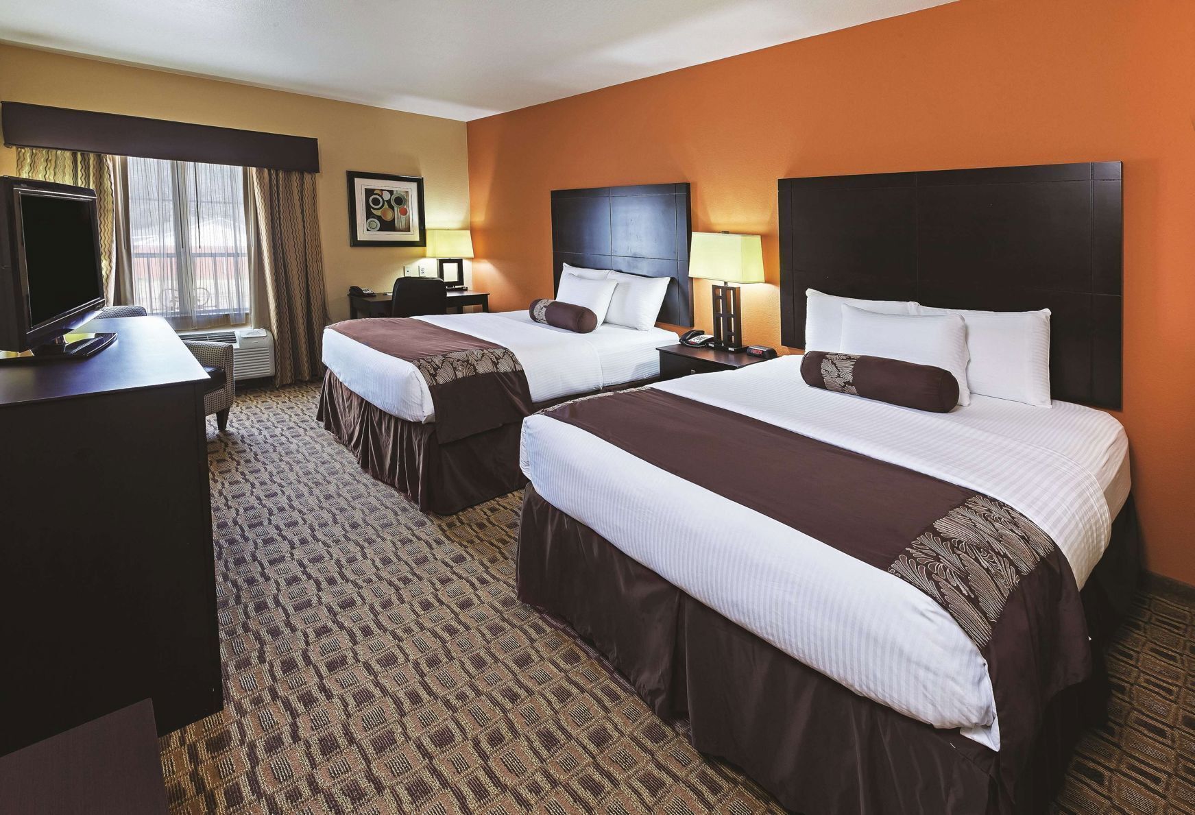 Premium bedding, desk, laptop workspace, soundproofing