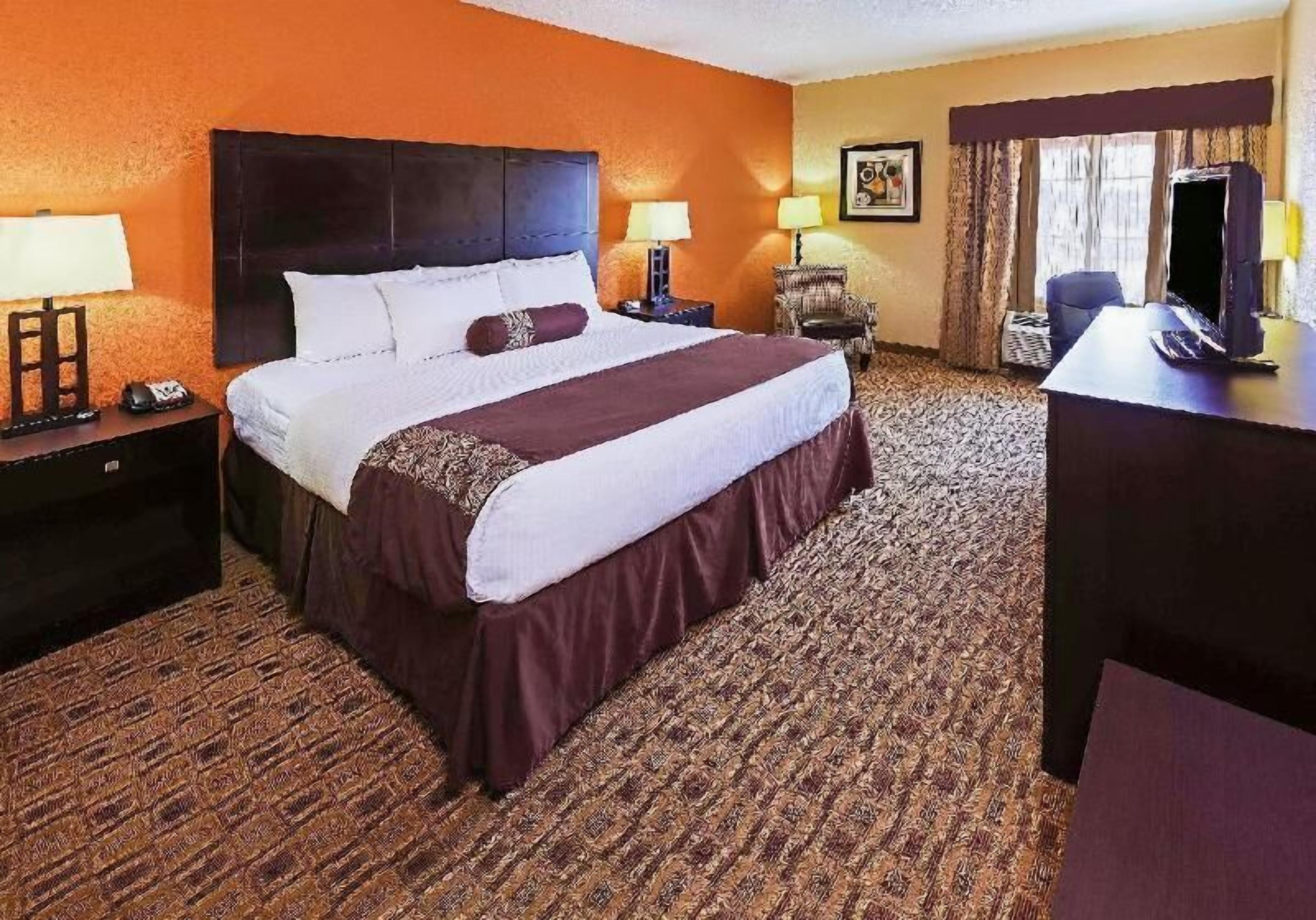 Premium bedding, desk, laptop workspace, soundproofing