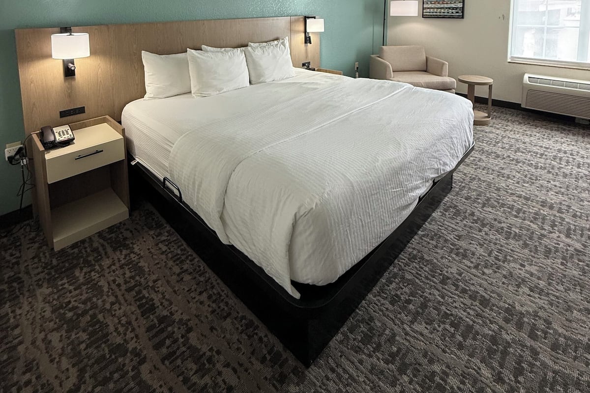 Premium bedding, desk, laptop workspace, soundproofing