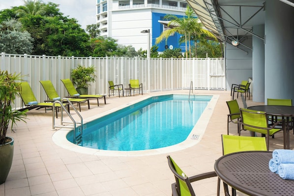 Outdoor pool, open 6:00 AM to 11:00 PM, pool loungers