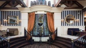 A grand staircase with ornate railings and a decorative fountain at the center. - Four Seasons Hotel & Leisure Club Monaghan (Monaghan)