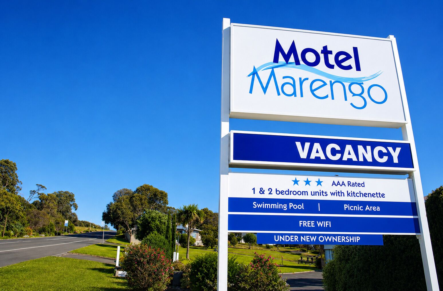 A sign for Motel Marengo advertising a vacancy, 1 & 2 bedroom units with kitchenette, swimming pool, picnic area, free WiFi, and under new ownership.