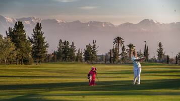 Enjoy a serene golfing experience with breathtaking views of the surrounding mountains.