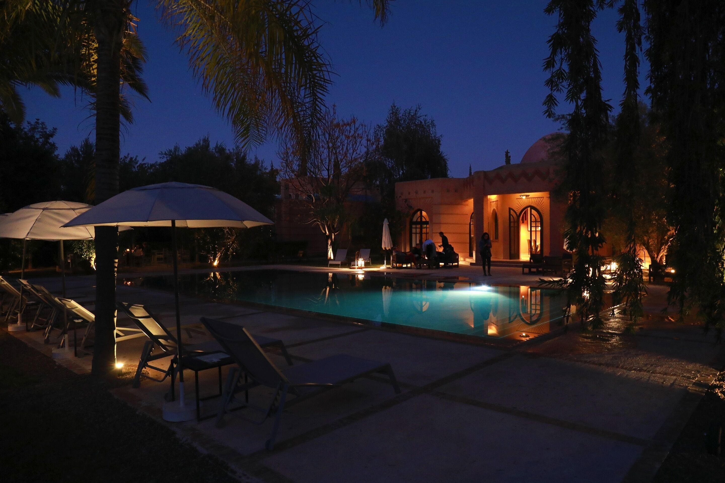 Outdoor pool, a heated pool, pool umbrellas, pool loungers