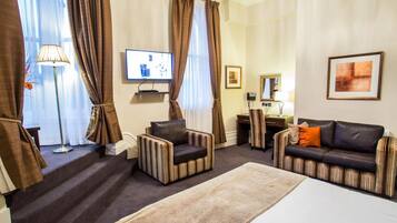 Executive Double Room | Living area | Flat-screen TV