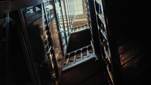 A view of a staircase with metal railings and wooden steps, leading to an upper floor. - Duke Of Edinburgh Hotel (Barrow-in-Furness)