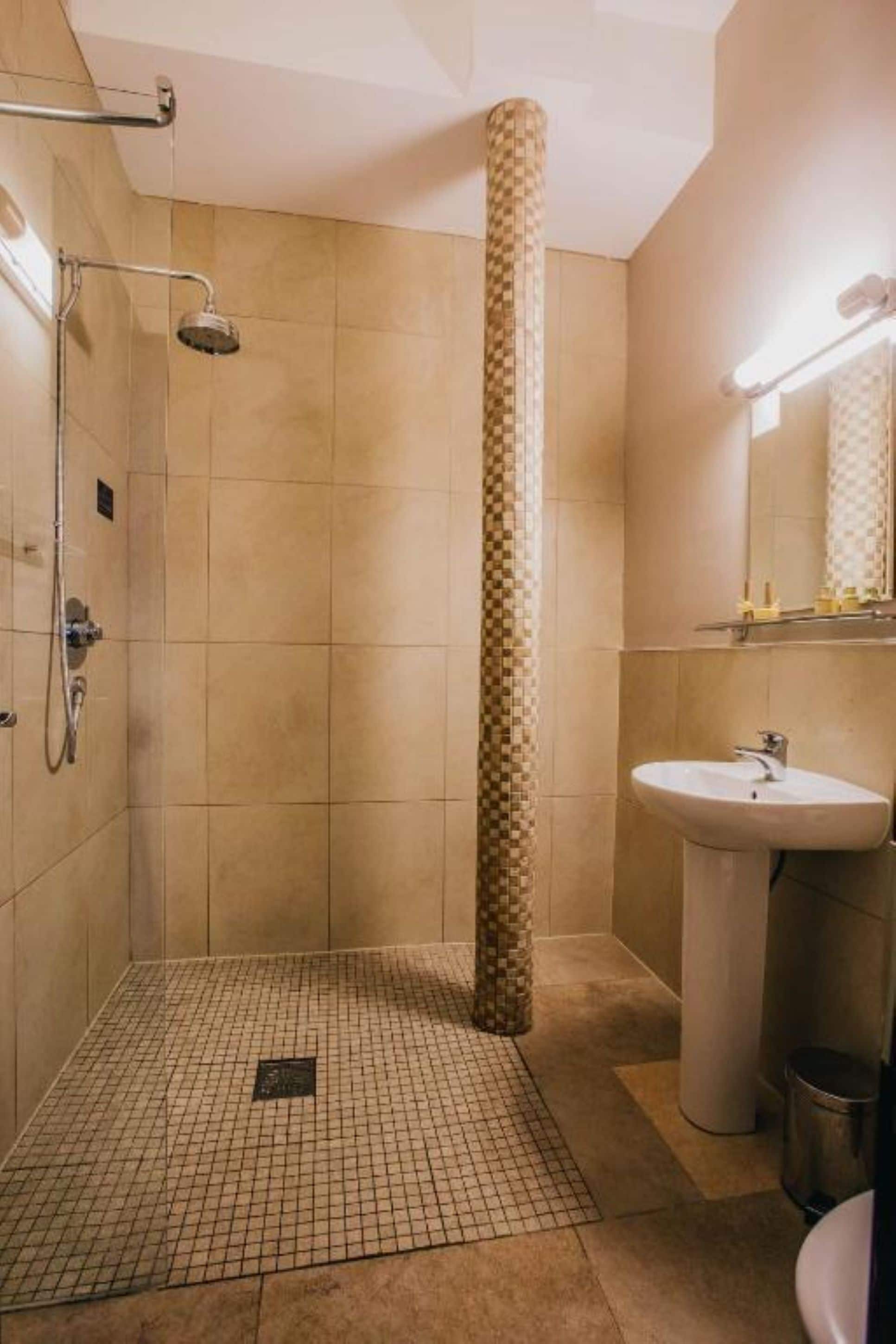 standard double room | bathroom | designer toiletries, hair dryer, towels