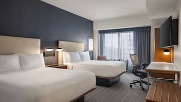 Premium bedding, down comforters, pillowtop beds, in-room safe
