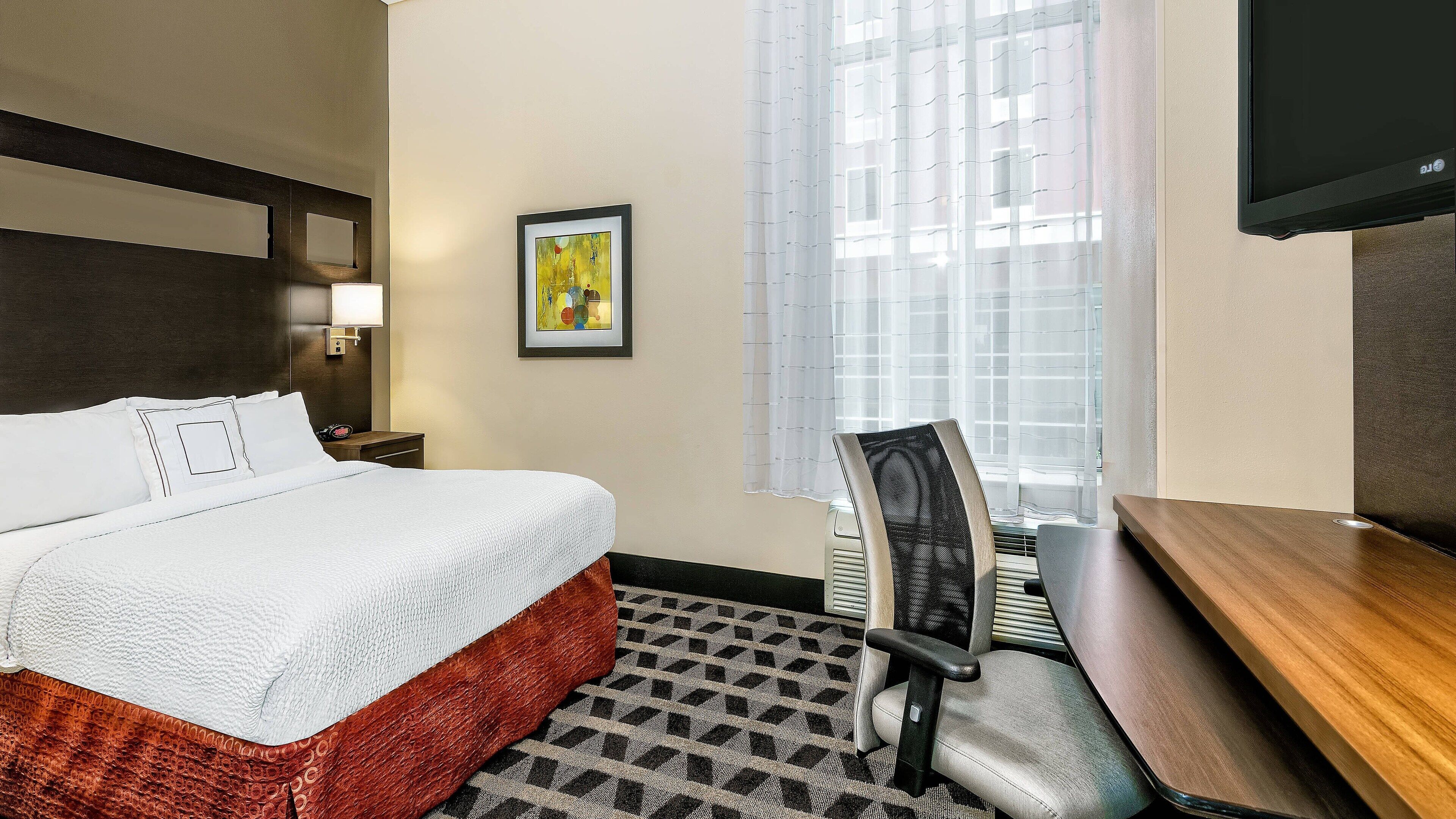 premium bedding, pillow-top beds, desk, laptop workspace