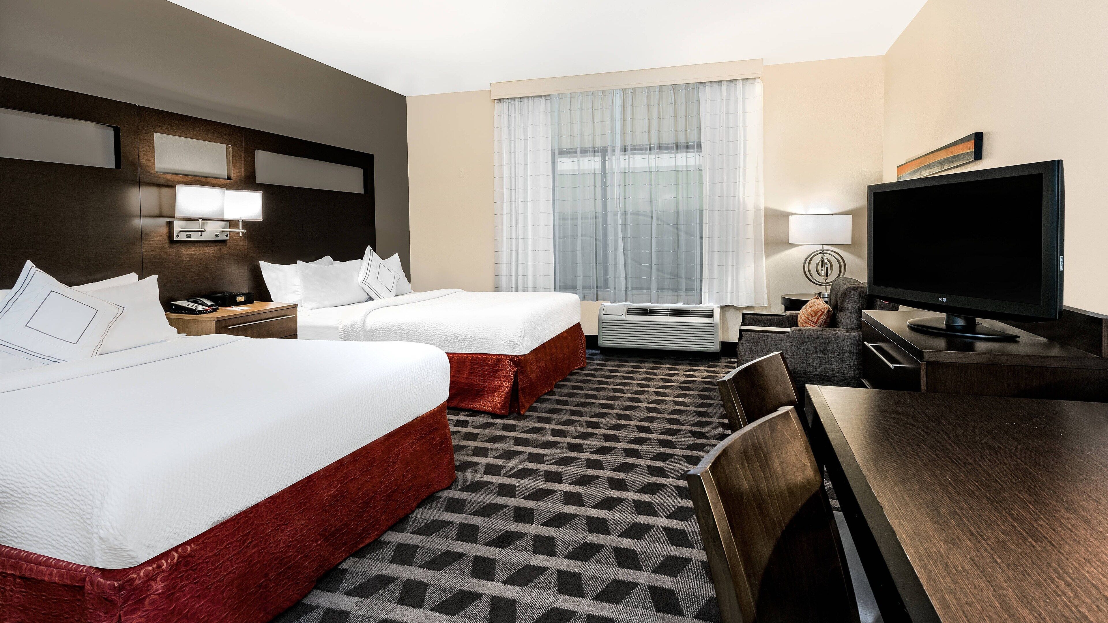 premium bedding, pillow-top beds, desk, laptop workspace