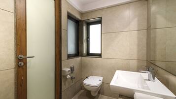 Shower, rainfall showerhead, designer toiletries, hair dryer