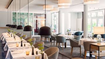 Breakfast, dinner served; international cuisine, garden views