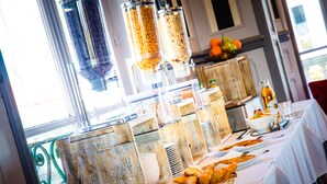 A buffet setup with various food items and containers. - La Villa Andry (Ouistreham)